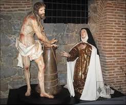 Cristo llagado junto a la Santa
